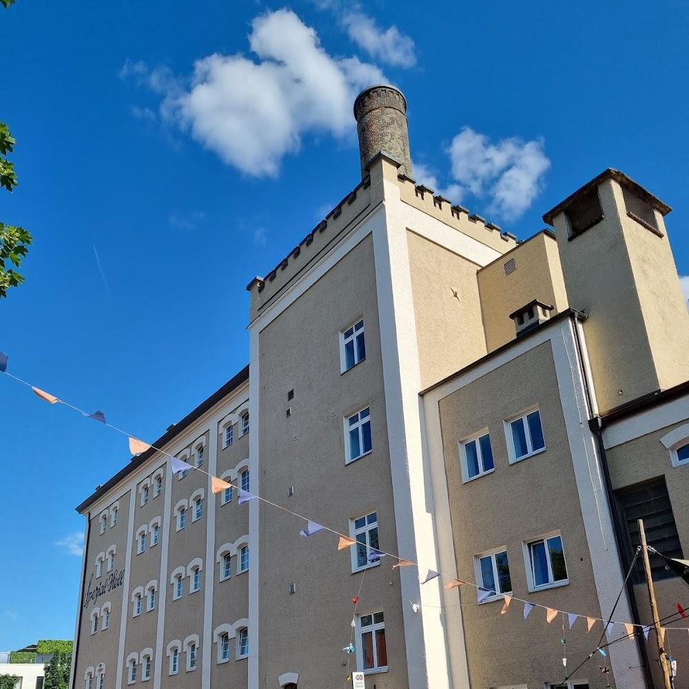A large building with a tower and many windows.